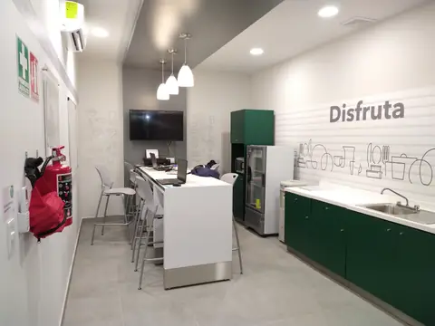 Área de descanso «Disfruta» con cocineta verde